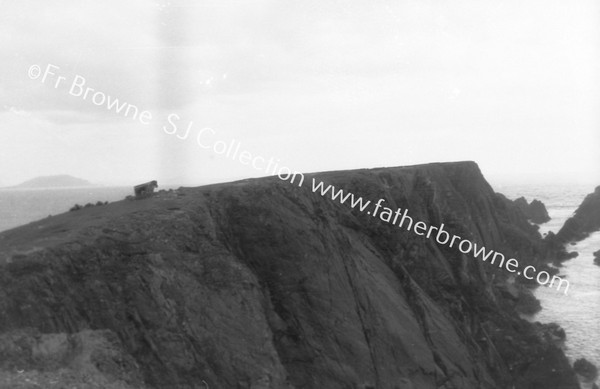 MALIN HEAD :CUTTING TURF ON CLIFF HEAD